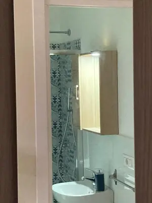 a bathroom with a sink and a shower at B&B Garibaldi in Palermo