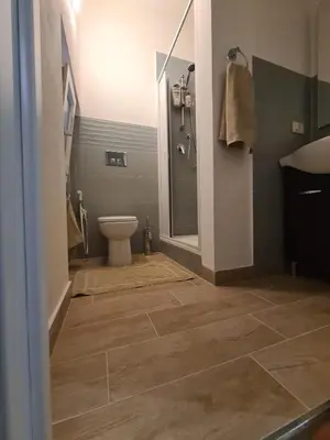 a bathroom with a toilet and a shower at Casa Nenè in Trabia