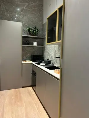 a kitchen with white cabinets and a stove top oven at YourLife Suite1 - Deliziosa casa con terrazzino in Palermo