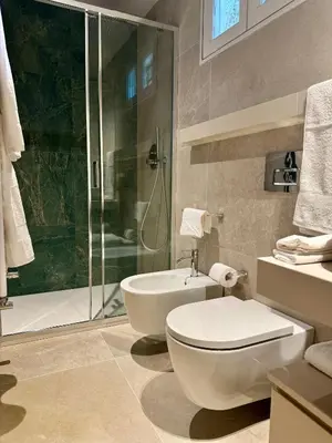 a bathroom with a toilet and a sink and a shower at YourLife Suite1 - Deliziosa casa con terrazzino in Palermo