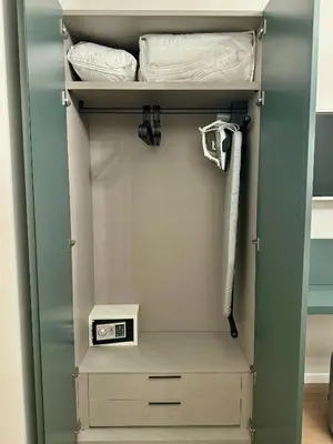 a walk in closet with a door open at YourLife Suite1 - Deliziosa casa con terrazzino in Palermo
