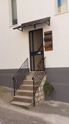 a staircase leading to a building with a door at Civico 88 in Calatafimi