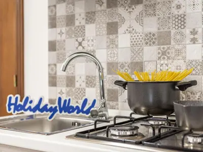a pot on top of a stove with a sink at La Casetta di Mari by Holiday World in Villabate