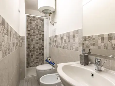 a bathroom with a sink and a toilet at La Casetta di Mari by Holiday World in Villabate