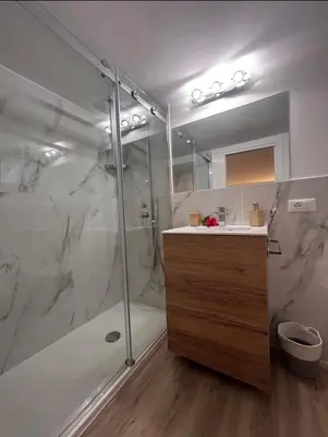 a bathroom with a shower and a sink at Loft Sferra d aMare in Sferracavallo