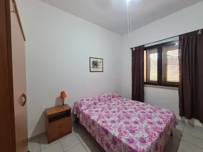 a small bedroom with a bed and a window at Casa il Sole Casevacanze Ferienwohnung Daniele Furco in Castellammare del Golfo