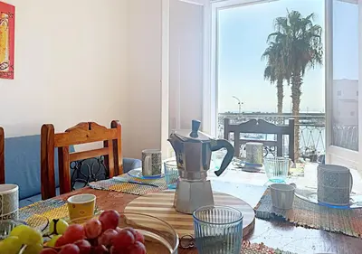 a table with affeepot on a table with fruit on it at Solemar Sicilia - Palazzo Eos e Aura in Porticello