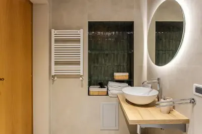a bathroom with a sink and a mirror at Prospettiva Ballarò - Sopra il mercato in Palermo