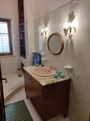a bathroom with a sink and a mirror at Villalba in Castellammare del Golfo