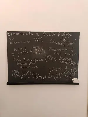 a blackboard with writing on it at Porto Felice Home Palermo in Palermo