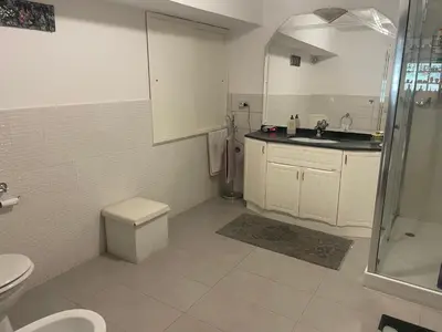 a bathroom with a toilet and a sink and a shower at La Terrazza del Sole in Lido di Mondello