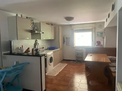 a kitchen with a sink and a washing machine at La Terrazza del Sole in Lido di Mondello
