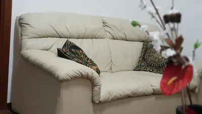 a white couch with two pillows on it at Pinhouse Apartment in Palermo