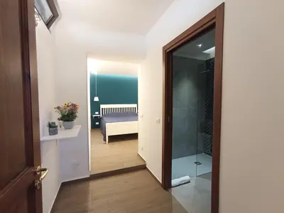 a hallway with a door leading to a bedroom at Casa di Lele in Carini