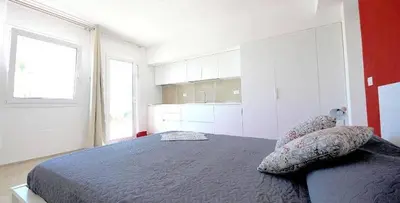 a bedroom with a bed and a large window at Villa Dwellings With Pool For Exclusive Use in Alcamo
