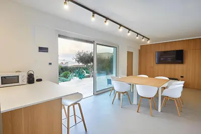 a kitchen and dining room with a table and chairs at Villa Dwellings With Pool For Exclusive Use in Alcamo