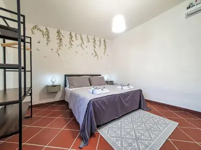 a bedroom with a bed with two towels on it at Holiday Home Maya's Home Palermo by Interhome in Palermo