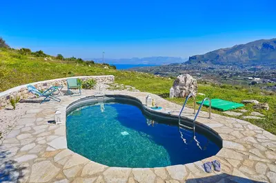 a large swimming pool on top of a hill at Villa Sirena - Scopello-Villas in Scopello