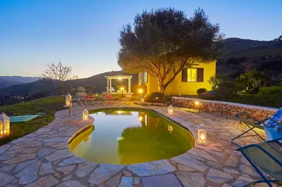 a small pool in a yard with a house at Villa Sirena - Scopello-Villas in Scopello