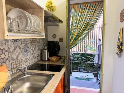 a kitchen with a sink and a window at Orange Lemon Garden Palermo in Palermo