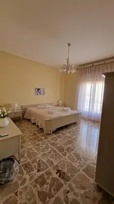a bedroom with a large bed in a room at Casa vacanza-Il Sole di Sicilia in Vita