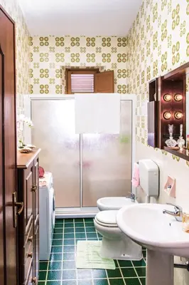 a bathroom with a toilet and a sink at Casa Dorotea in Balestrate