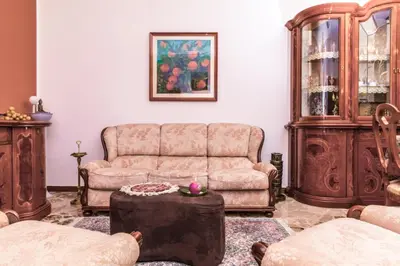 a living room with a couch and a table at Casa Dorotea in Balestrate