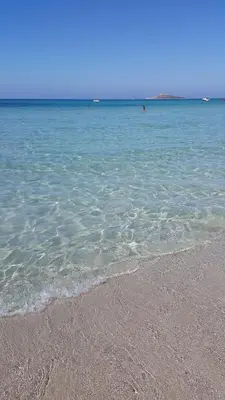 a beach with a body of water and the ocean at Il Cavaliere Apartment in Capaci