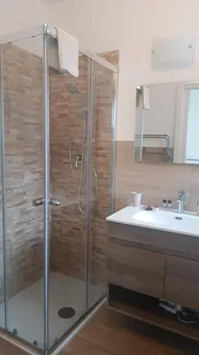 a bathroom with a shower and a sink at Metro 171 Loft in Palermo