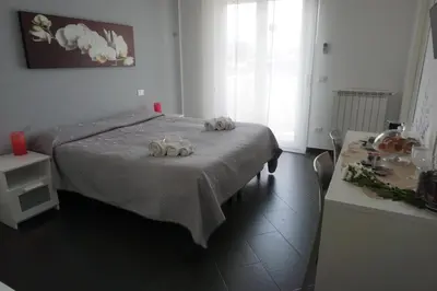a bedroom with a bed with two stuffed animals on it at Bed and Breakfast Palermo Centro in Palermo