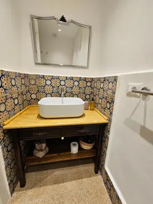 a bathroom with a sink and a mirror at Casa Novelli 22 - Vista sulla Cattedrale in Palermo