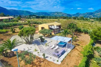 an aerial view of a house with a solarium at Villa del Drago in Scopello