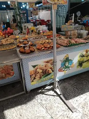 a table with different types of food on it at Aura's Apartment in Palermo