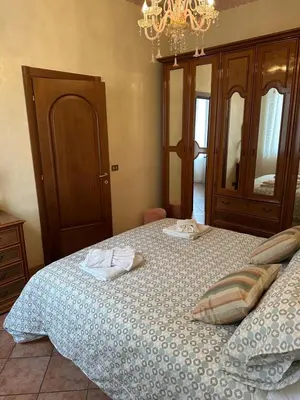 a bedroom with a bed with white cabinets at Girasole in Palermo