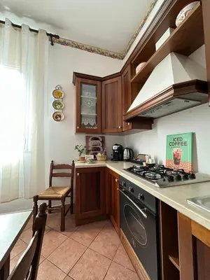 a bedroom with a large bed with a chandelier at Girasole in Palermo