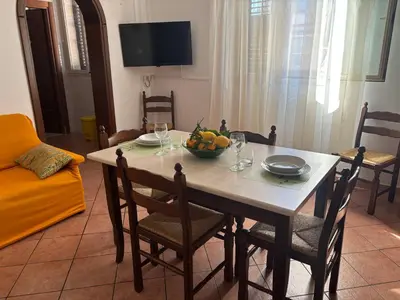 a living room with a couch and a table at Girasole in Palermo