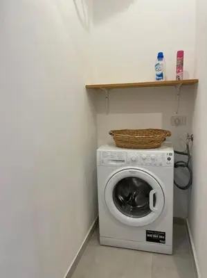 a washing machine with a basket on top of it at Coralìa in San Vito lo Capo