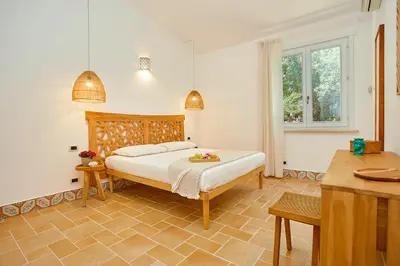 a bedroom with a bed in a room at Villa Lo Zingaro - Scopello-Villas in Scopello