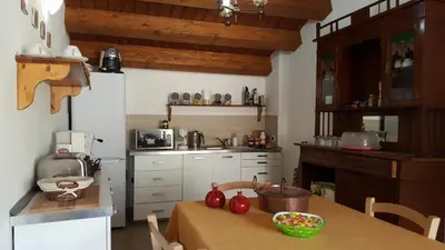 a kitchen with a table with tomatoes on it at PalermiT'Amo in Palermo