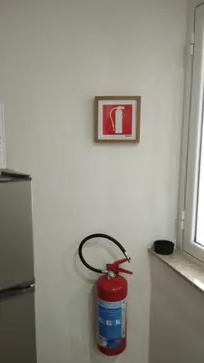 a fire hydrant is on the wall of a kitchen at Casa Sabo Apartment in Palermo