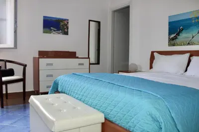 a living room with a couch and a table at Gli ulivi di Cala Rossa By Dimora Hub in Terrasini