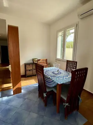 a dining room with a table and four chairs at Gli ulivi di Cala Rossa By Dimora Hub in Terrasini