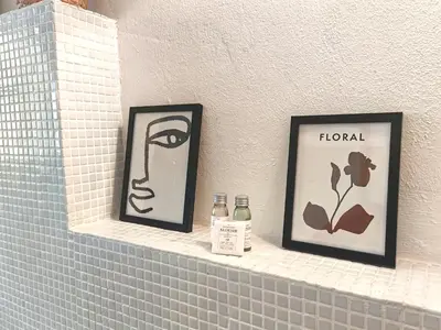 two framed pictures on a shelf in a bathroom at Centro storico-Marina Free Parking, Wifi,Netflix in Palermo