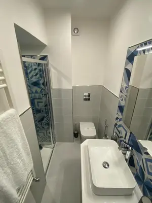 a bathroom with a sink and a shower and a toilet at Casa Vacanze dell'Arco - civico 17 in Trabia