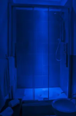 a bathroom with a shower with a glass door at Due Passi in Palermo