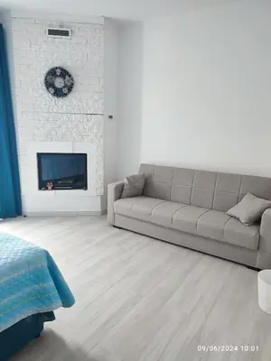 a living room with a couch and a fireplace at Tramonti d'Alba in Terrasini