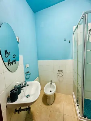 a bathroom with a sink and a toilet at Casa Lilla in Monreale
