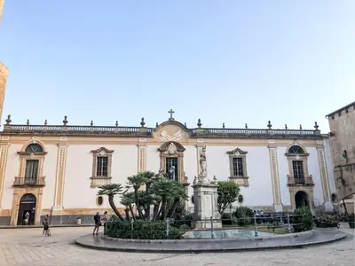 a large building with a fountain in front of it at Villa Ginestra by Interhome in Piana degli Albanesi