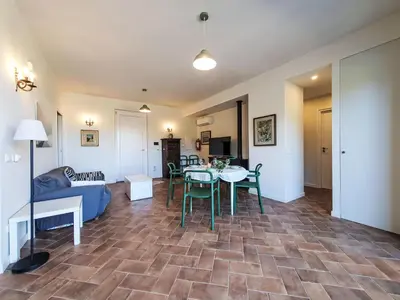 a living room with a table and a couch at Villa Ginestra by Interhome in Piana degli Albanesi