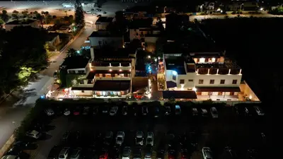 an aerial view of a city at night at Residence Hotel Marino Tourist in San Vito lo Capo